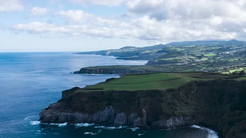Clouds casting shadow on the rocky cliffs of the island Sao Miguel in the Azores Stock Footage 165475783