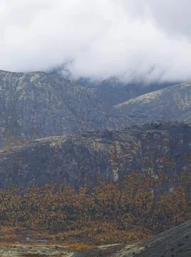 The clouds caught on the tops of the mountains. Low clouds in the mountains Stock Photos