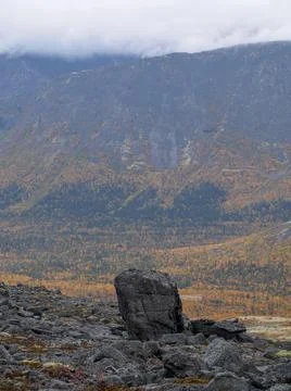 The clouds caught on the tops of the mountains. Low clouds in the mountains.  Stock Photos