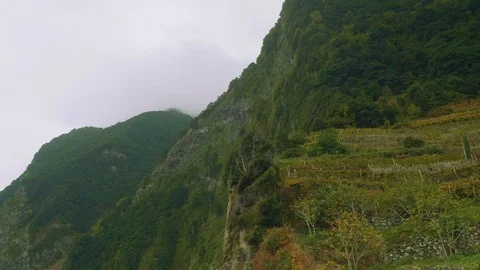 Clouds caught on tops of mountains of Madeira Stock Footage 90103679