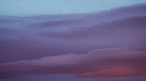 Clouds changing color as the sunsets. Stock Footage 60793856