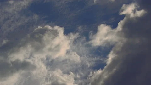 The clouds chase each other fast in the colorful sky of dawn Stock Footage 161784273