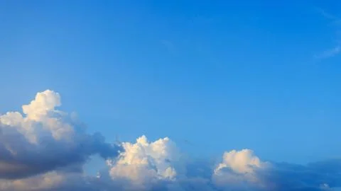 Clouds on clear blue sky Stock Photos