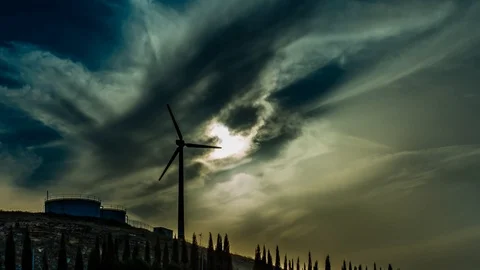 Clouds Clearing the Sun above a rotating Windmill/Wind turbine Stock-Footage 88554107