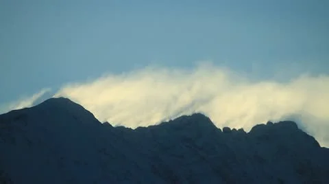 Clouds climbing over mountain. Stock Footage 10756282