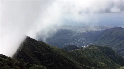 Clouds climbing over a mountain peak Stock Footage 59151938