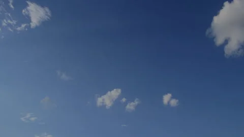 Clouds coalesce in blue sky and progress to dark and angry sky, 4K. Stock Footage 164416636