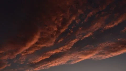Clouds colored by the light of the setting sun Stock Footage 138734769