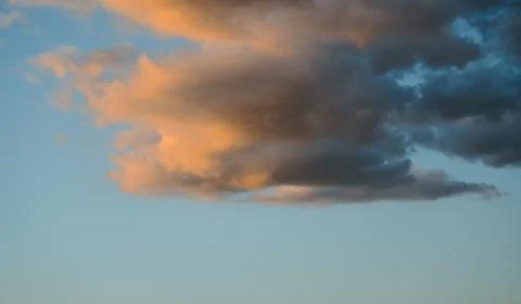 Clouds with the colors of the setting sun Stock Photos