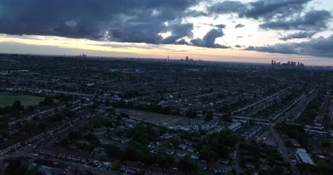 Clouds in colourful twilight sky above city, residential neighbourhood Vídeos de archivo 201884279