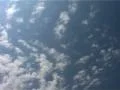 Clouds with Contrail and Plane passing through, Heathrow London England SD Footage