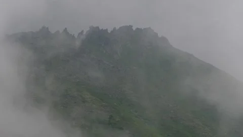 Clouds cover broken mountain top. Timelapse. Subpolar Ural. Uralic Mountains Stock Footage 269143304