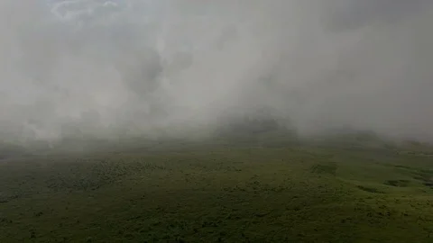Clouds cover mountain meadows on the plateau. Stock Footage 112735999