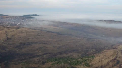 The clouds cover the mountain town. top view Aerial Stock Footage 58254368