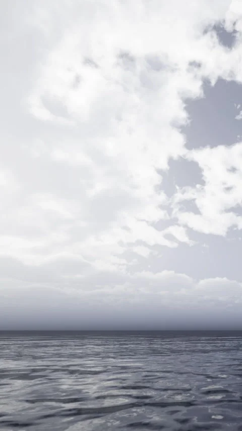 Clouds cover the sky above a large body of water during daytime 库存影片 335959610