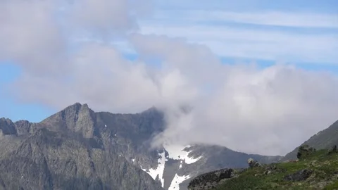Clouds cover up a snowy mountain. Timelapse. Subpolar Ural. Uralic Mountains Stock Footage 269139980