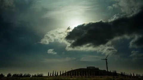 Clouds Covering and Clearing the Sun Above a Windmill/Windturbine Stock-Footage 88553719