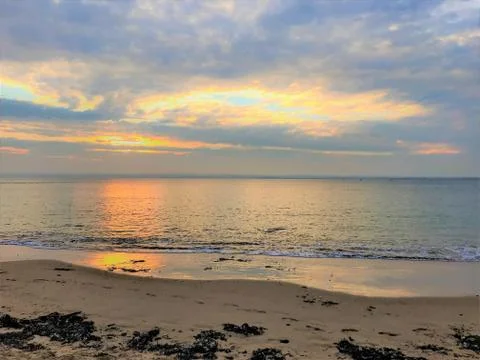 Clouds covering setting Sun, Phillip Island, Australia Foto stock
