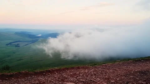 Clouds creep in from mountain top - Colour Corrected Stock Footage 288526470