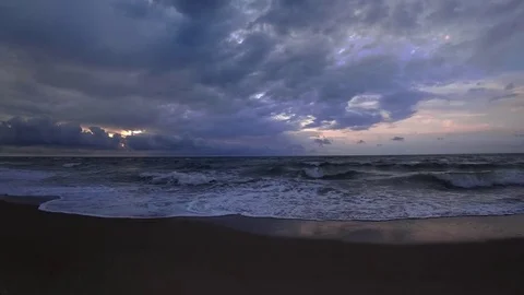 Clouds crossing the blue sky above the sea on twilight. Time lapse, wide angle. Video stock 80086240