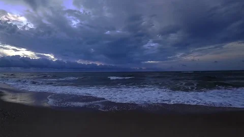 Clouds crossing the blue sky above the sea on twilight. Time lapse, wide angle. Stock Footage 80086243