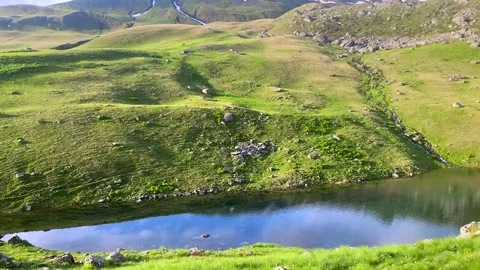 Clouds crossing Chaukhi Mountain frame Roshka Valley Stockbeeldmateriaal 340387537
