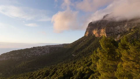 Clouds Crossing Mountain Peak at Sunset, Timelapse Stock Footage 341033626