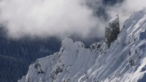 Clouds dancing around mountain landscape Stock Footage 102170964