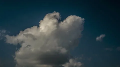 Clouds dancing at dark blue sky - timelapse Stock Footage 47006329