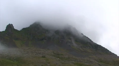 Clouds dancing over slope made of volcanic material in time lapse shot Stock Footage 37269714