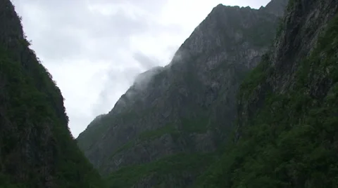 Clouds dancing on river canyon Stock Footage 33635263