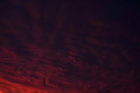 Clouds Dark red purple sky with clouds. Sunset. Dark sky landscape. Stock Photos