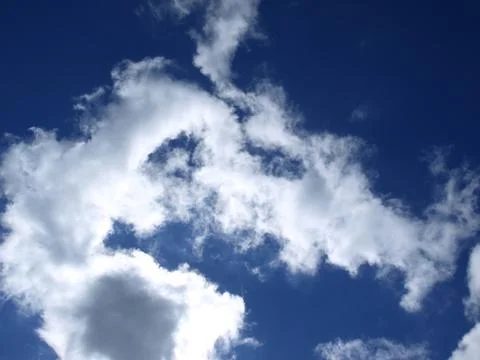 Clouds with the deep blue sky Stock Photos
