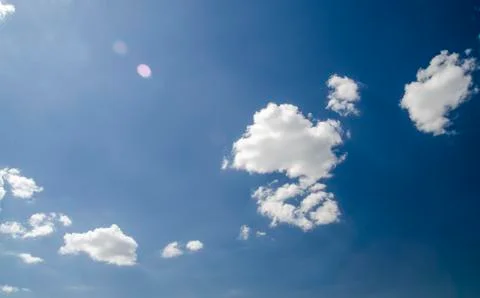 Clouds in deep blue summer sky Stock Photos
