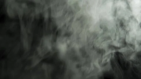 Clouds of dense smoke on a black background. The smoke moves and fills the space Stock Footage 157672469