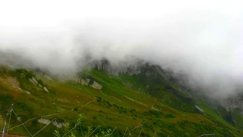 Clouds descending on Alpine meadows. Krasnaya Polyana. Video stock 102227456