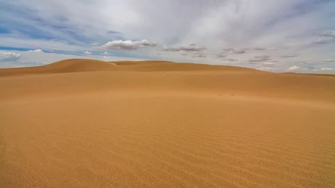 Clouds in the desert above the sand dunes Stock-Footage 83910045