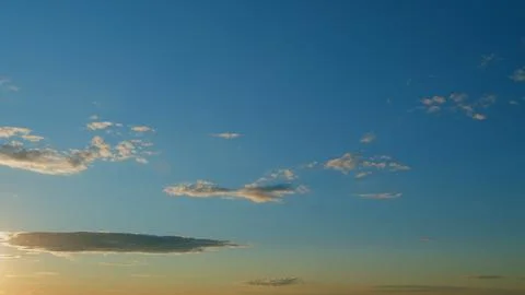 Clouds in different shades. Clouds during sunset. Panoramic view. Timelapse. Stock Photos