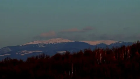 Clouds disappear by snow-capped mountains Stock Footage 70363517