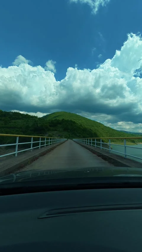 Clouds drift above the calm landscape. Zavoj Lake, Serbia. Vertical Stock-Footage 337494853