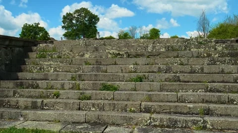 Clouds drift above a green hillside. Felix Romuliana, Jupiter Temple Stock Footage 335295985