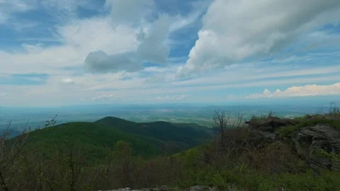 Clouds drift above rolling green hills. Jastrebac Mountain, Serbia. Timelapse Stock Footage 336023241