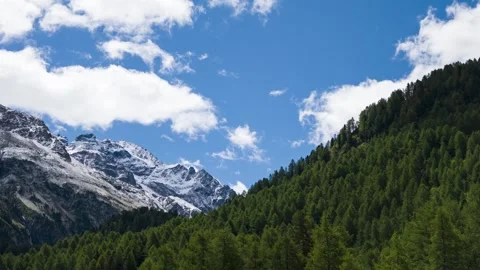 Clouds Drift Above Snow-Covered Mountains at Maloja Pass 库存影片 348895687