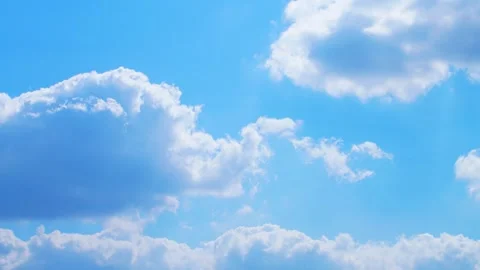 Clouds drift across a beautiful bright blue sky Timelapse Nature, Timelapse sky Stock Footage 329314987