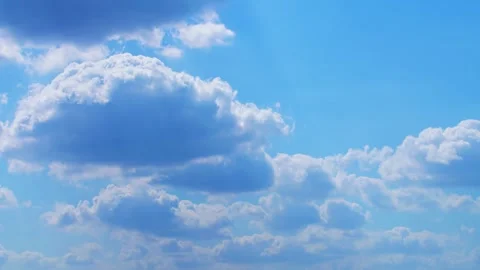 Clouds drift across a bright blue summer sky Timelapse Nature, Timelapse sky Stock Footage 329314989