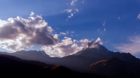 Clouds Drift and Billow over Mount Kazbek in Georgian Republic Stock Footage 100176366