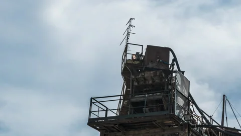 Clouds drift behind a tower of an abandoned factory, timelapse shot Stock Footage 156710187