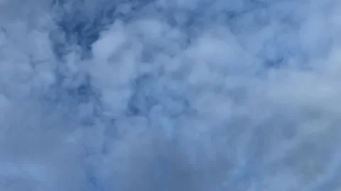 Clouds drift in the evening sky before sunset Stock Footage 314098368