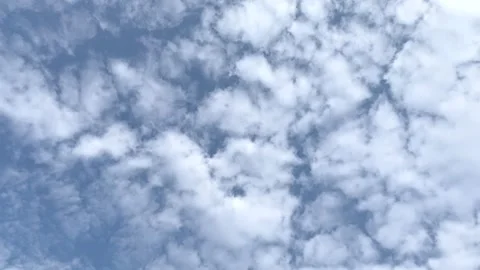 Clouds drift gracefully across the sky, forming a calm and atmospheric view. Stock Footage 311233092
