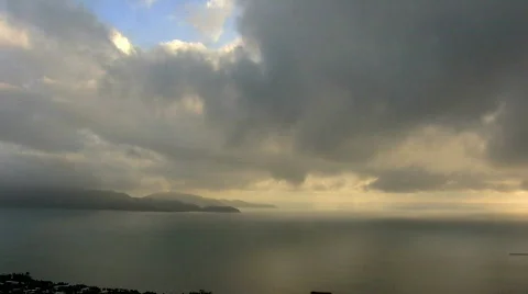 Clouds drift over island Stock Footage 358396